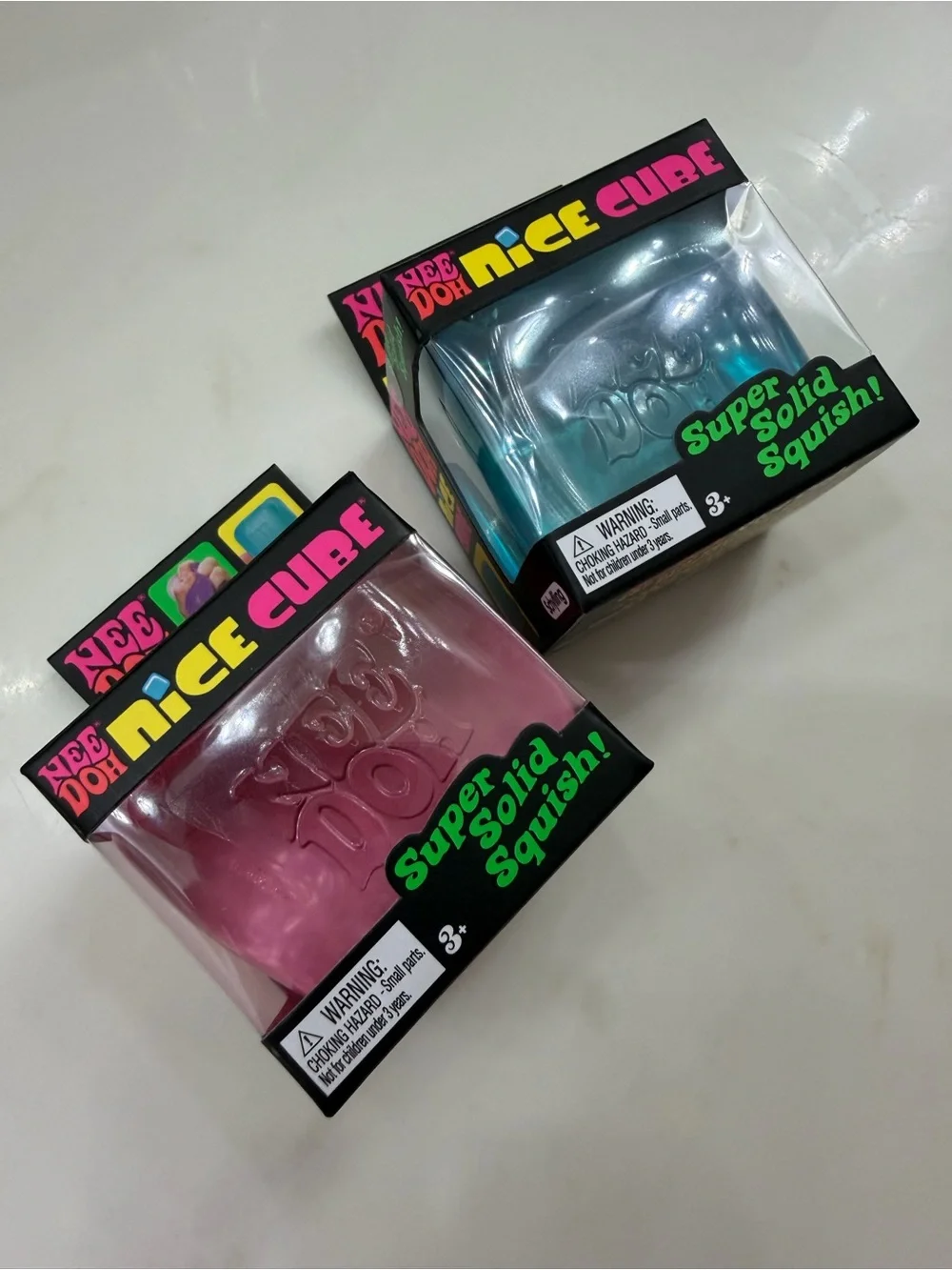 NeeDoh Nice Cube Super Solid Squish Toy - 2 Pack Bundle. Blue, Pink